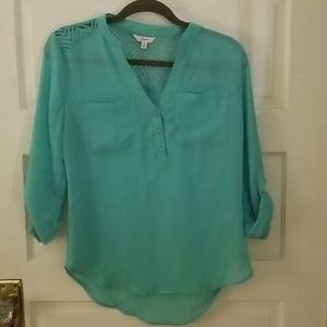 Sheer teal blouse with lace section in the back